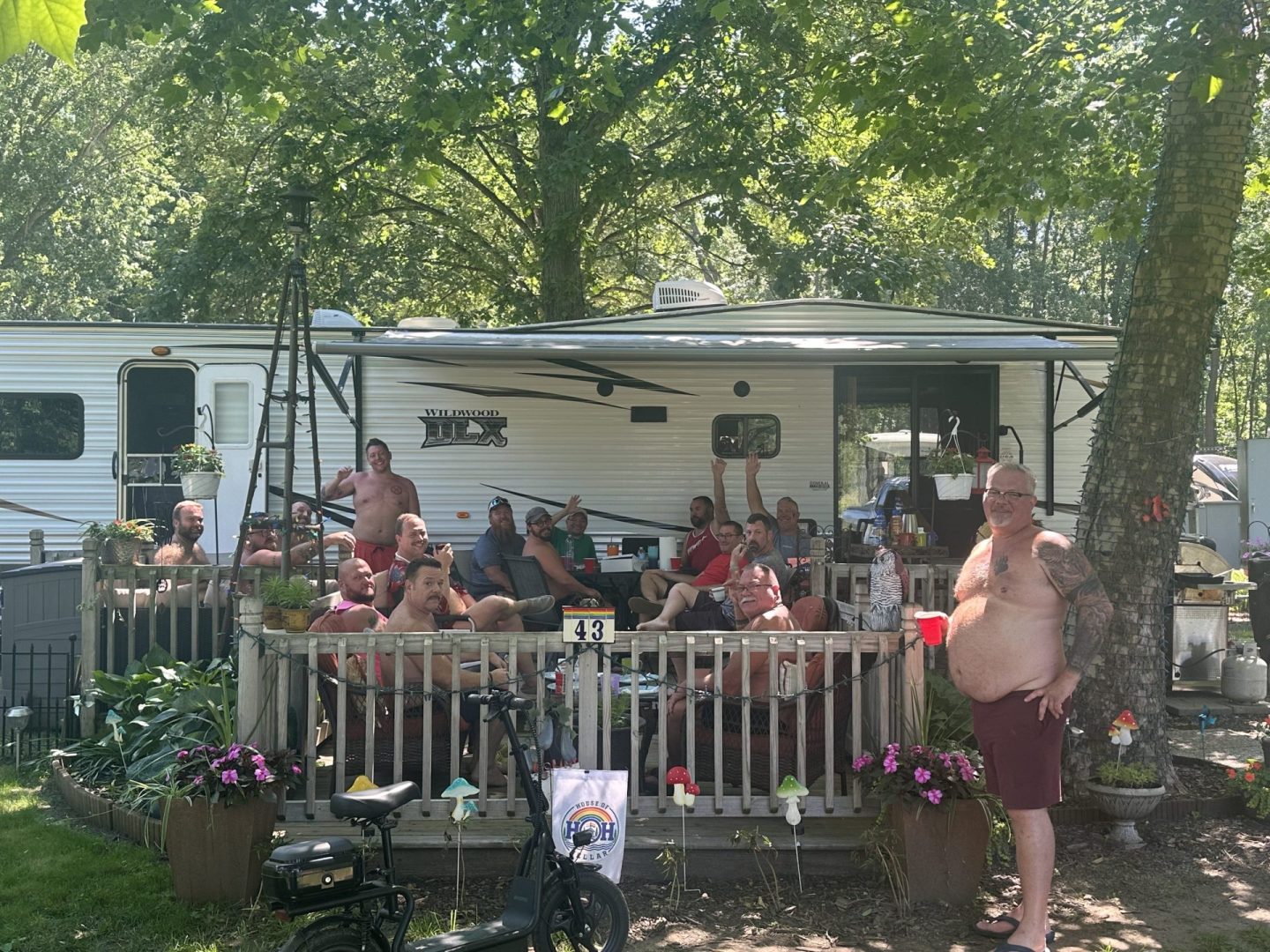 Members relaxing together at an RV campsite during a themed weekend at CreekRidge Campground.